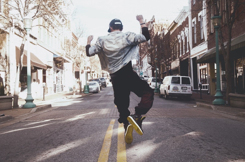 man jumping in street