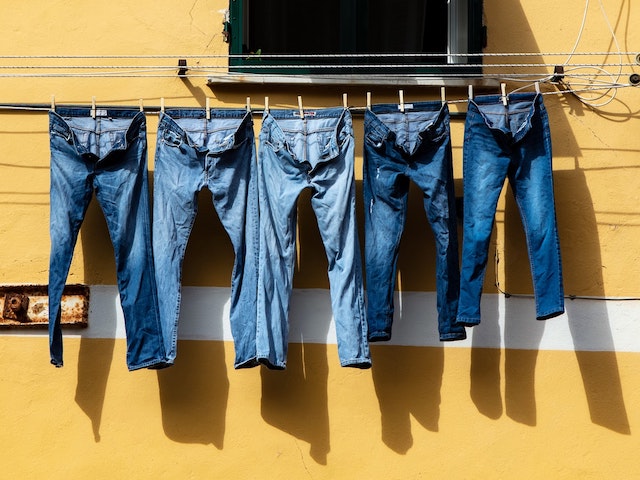 summer jeans hanging from window